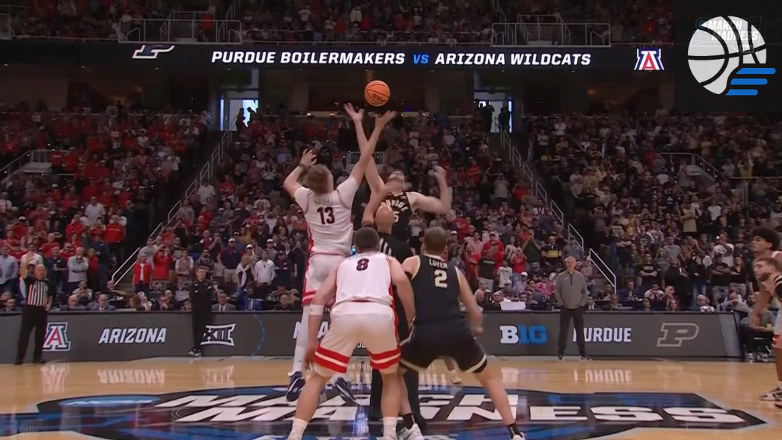 Arizona and Purdue players contesting a shot in the NCAA Tournament